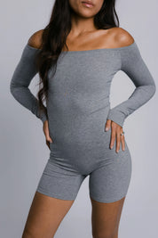 Model wearing the Billy Bardot Sculpt Suit in grey, front view.
