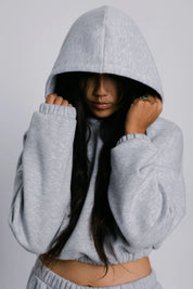 Model wearing the Billy Off-Duty Sweat in grey, front view.