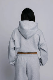 Model wearing the Billy Off-Duty Sweat in grey, back view.