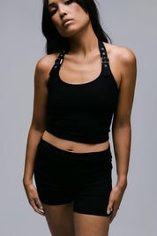 Model wearing the Billy Loop Sculpt Top in black, front view.