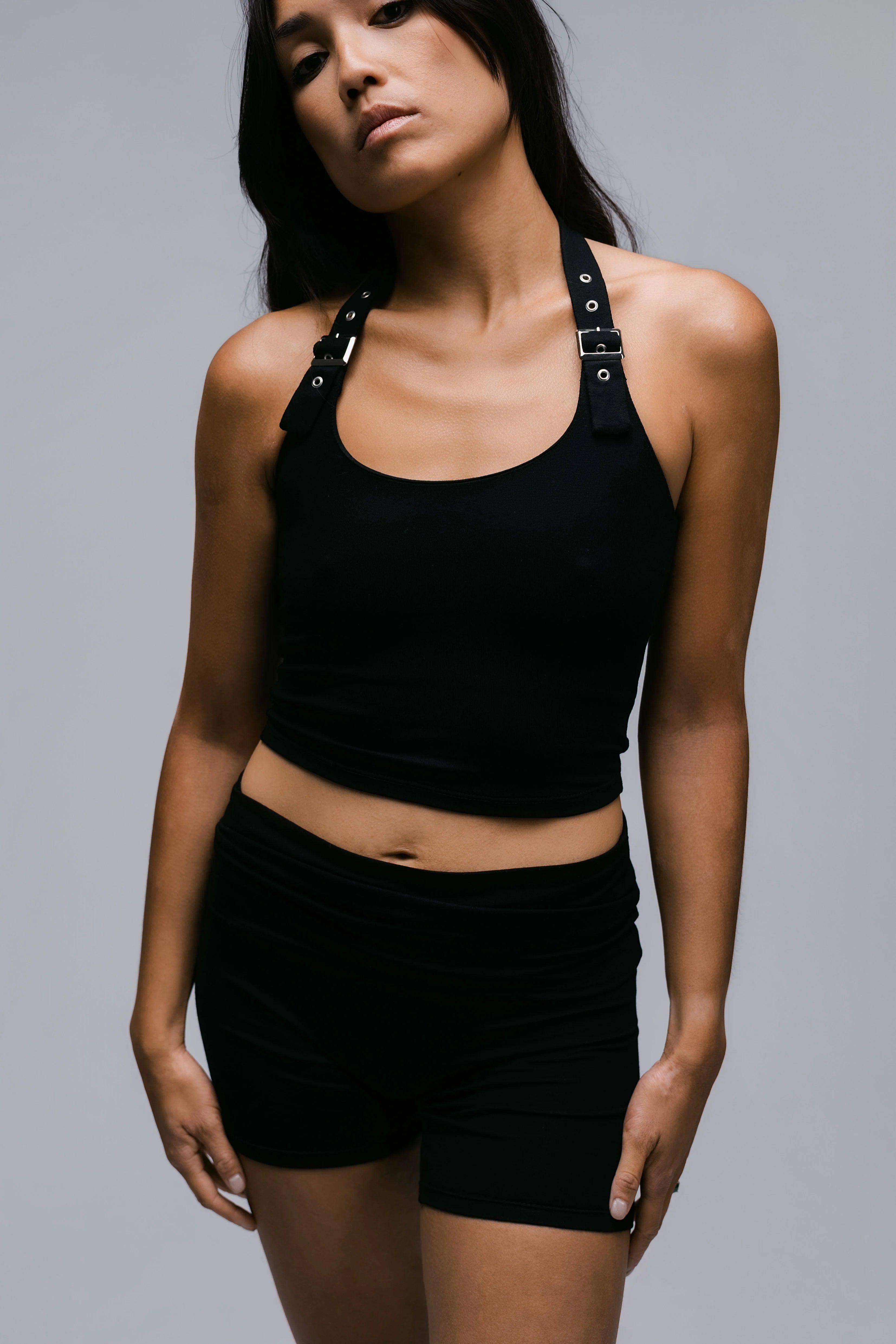 Model wearing the Billy Loop Sculpt Top in black, front view.