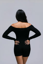 Model wearing the Billy Bardot Sculpt Suit in black, back view.